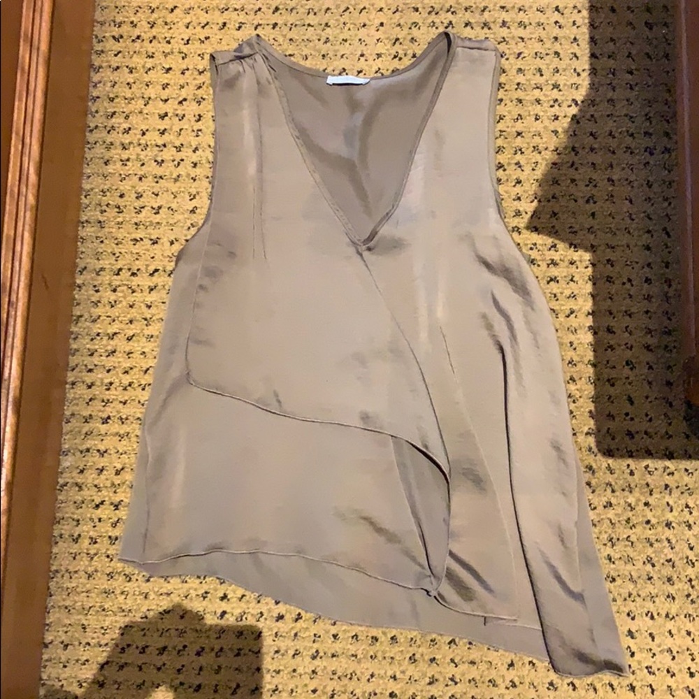 Brown tank shirt. Longer on one side.